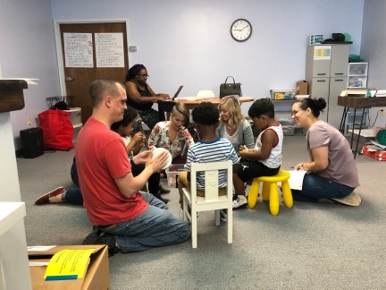 Kids working with staff